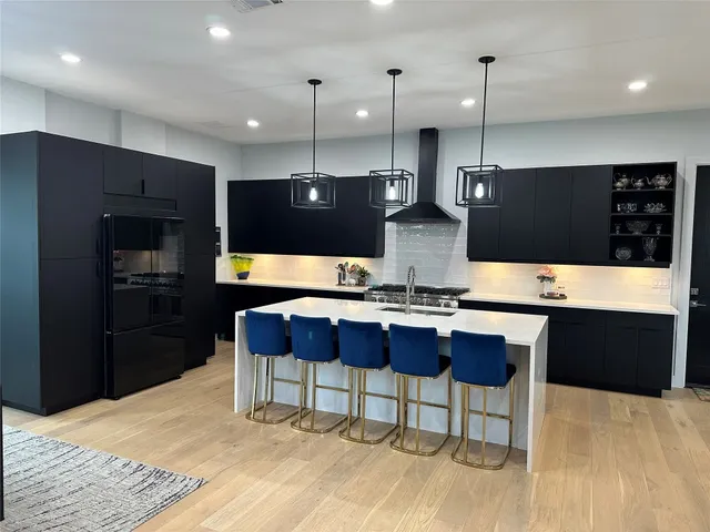 a kitchen with a table and chairs in it