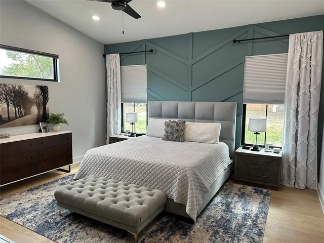 a bedroom with a bed and a dresser