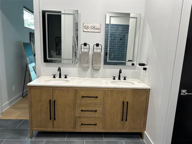 a bathroom with a sink and a mirror