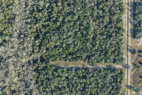 an aerial view of residential house and outdoor space