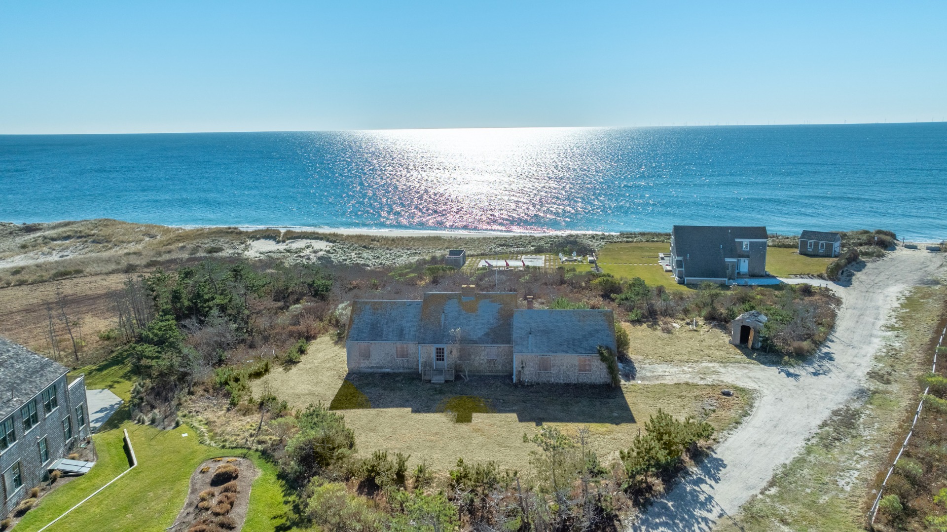 8 Macy Road Nantucket, MA 02554 - Photo 9 of 9 a view of a back yard of the house and an ocean