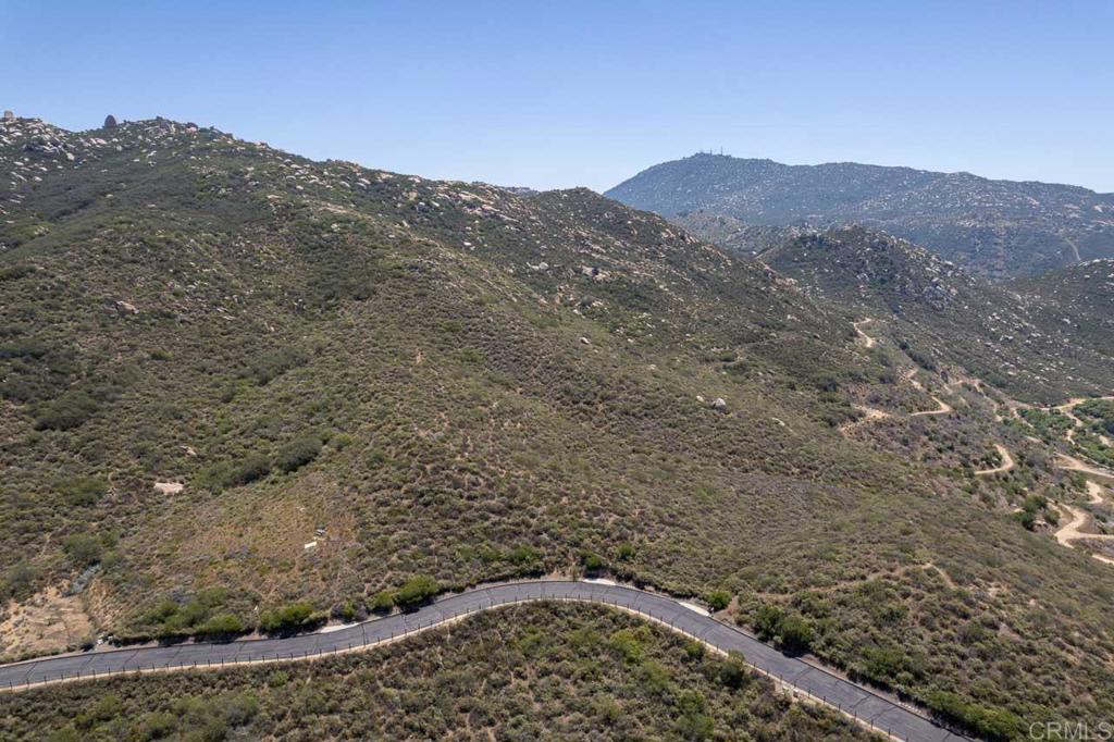 18055 Sunset Point Poway, CA 92064 - Photo 3 of 39 a view of a dry yard with mountains in the background