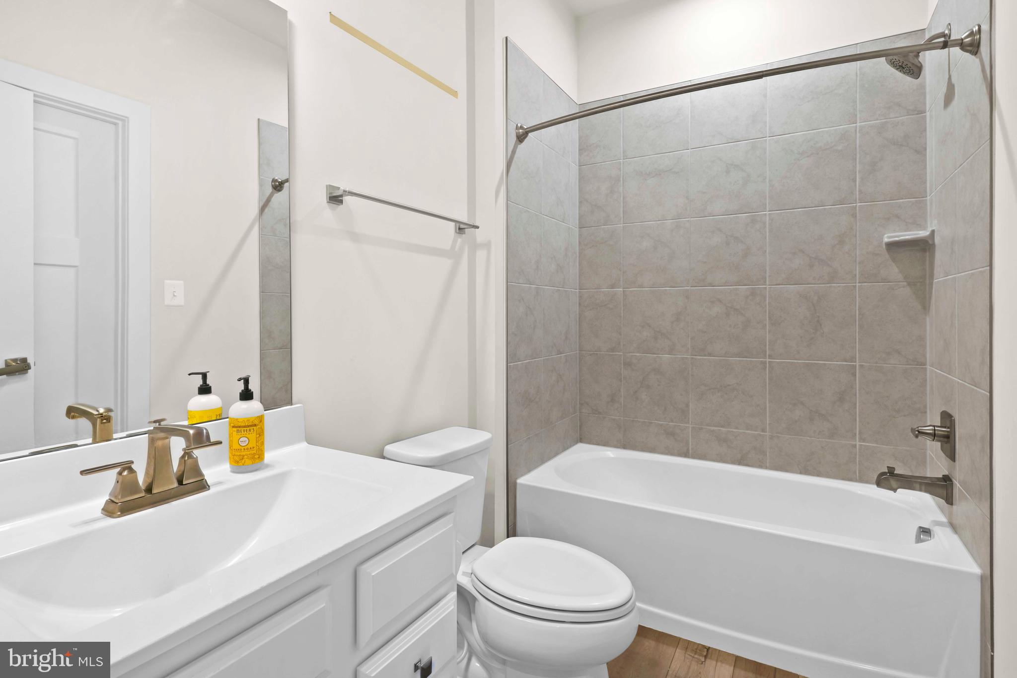 3903 Emory Ridge Road Brandywine, MD 20613 - Photo 14 of 42 a bathroom with a sink toilet and shower
