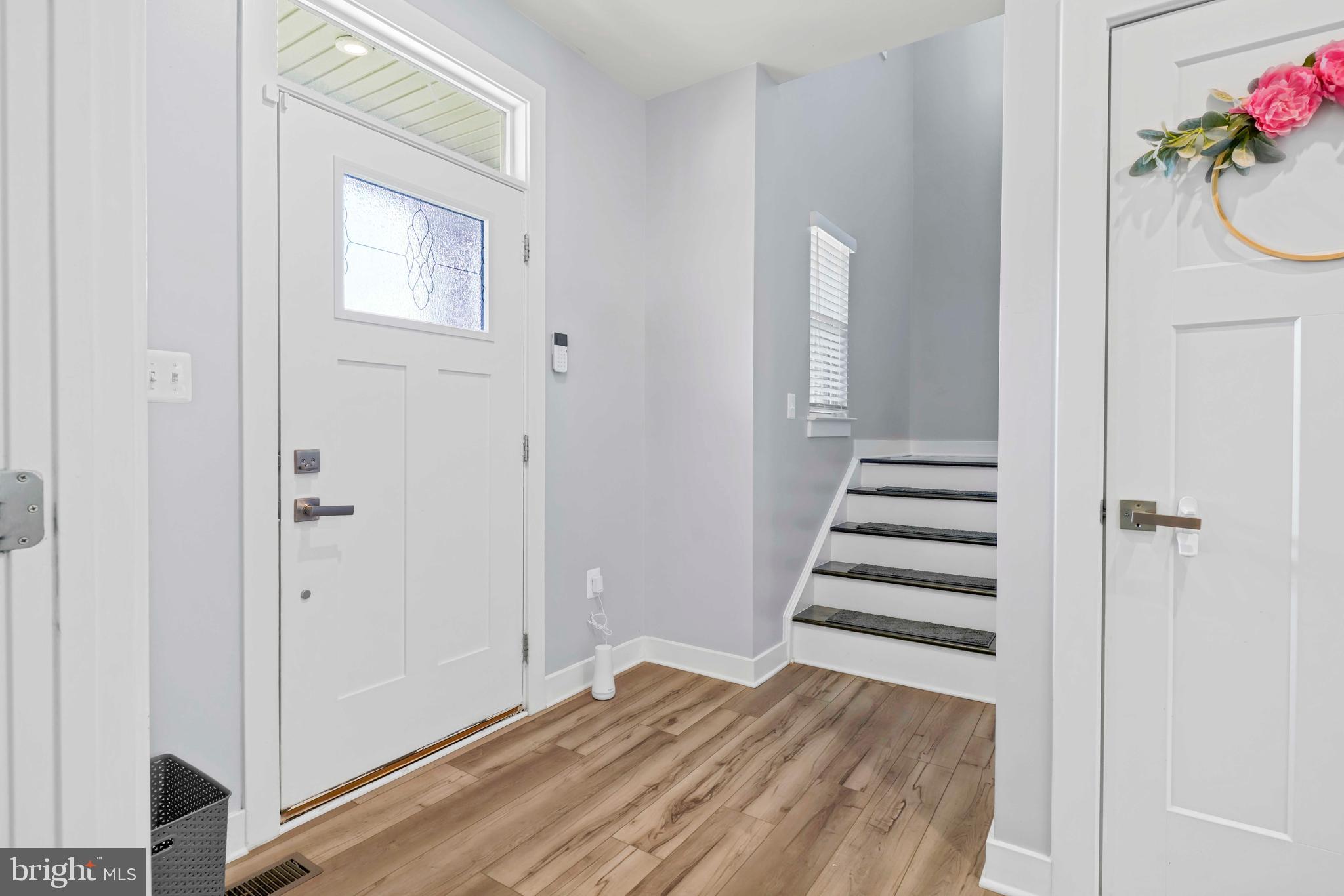 3903 Emory Ridge Road Brandywine, MD 20613 - Photo 16 of 42 a view of a bedroom with wooden floor and stairs