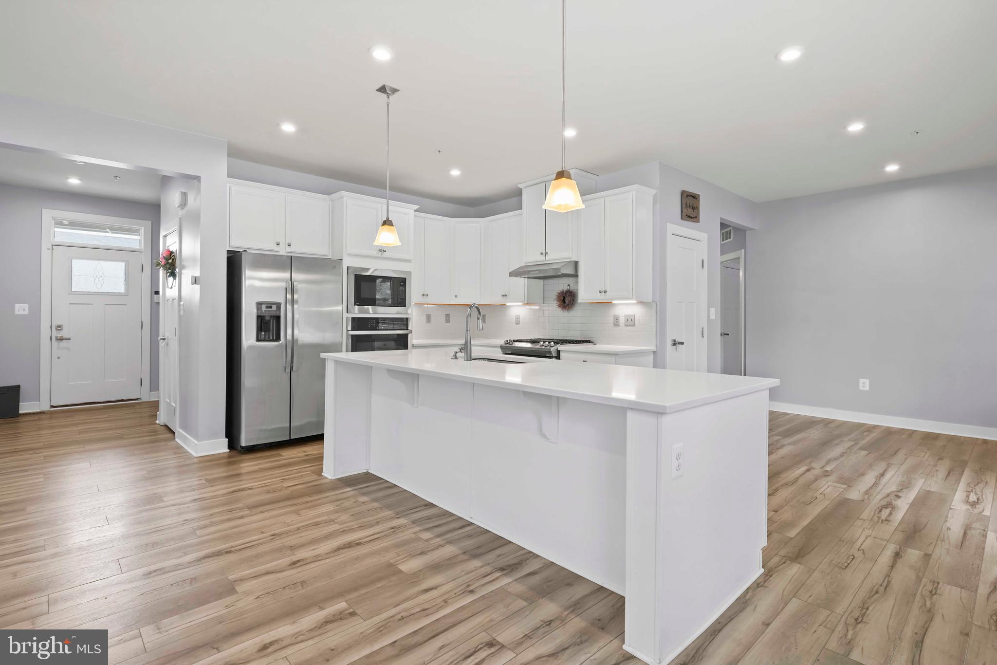3903 Emory Ridge Road Brandywine, MD 20613 - Photo 2 of 42 a kitchen with stainless steel appliances a refrigerator sink and microwave