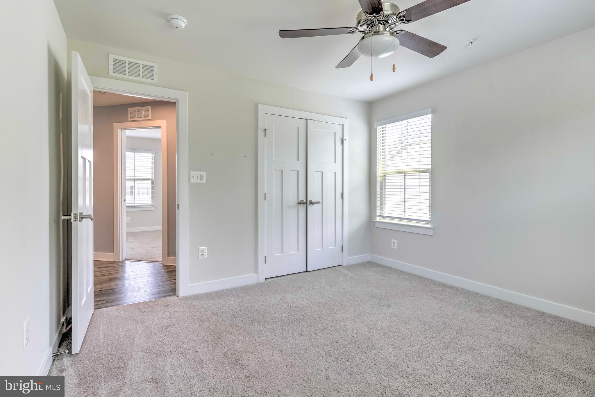 3903 Emory Ridge Road Brandywine, MD 20613 - Photo 25 of 42 a view of an empty room with chandelier fan and fire place
