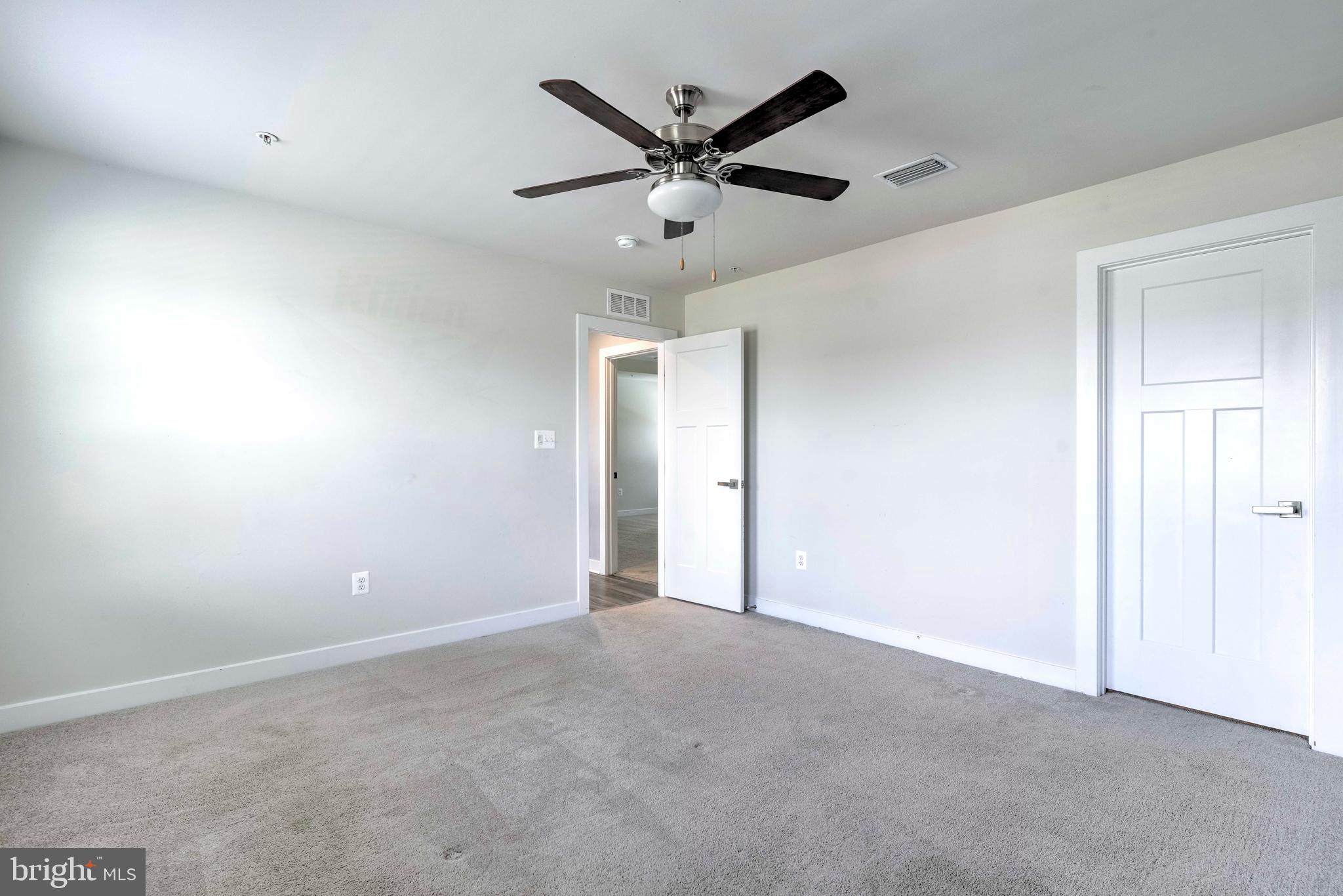 3903 Emory Ridge Road Brandywine, MD 20613 - Photo 28 of 42 an empty room with closet and ceiling fan