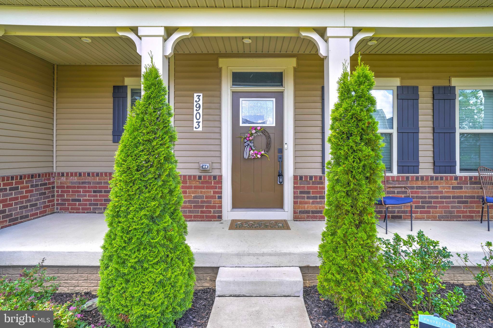 3903 Emory Ridge Road Brandywine, MD 20613 - Photo 41 of 42 a couple of potted plants in front of a house