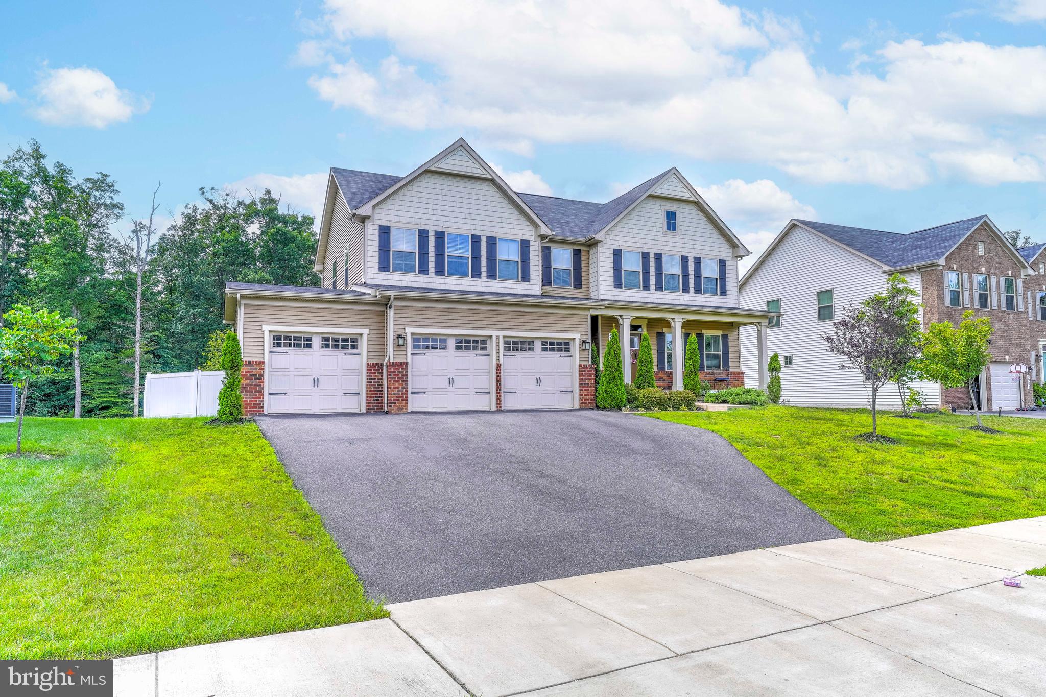 3903 Emory Ridge Road Brandywine, MD 20613 - Photo 42 of 42 a front view of a house with a yard and garage