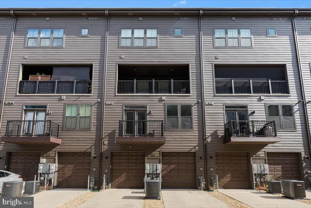 a front view of a building with many windows