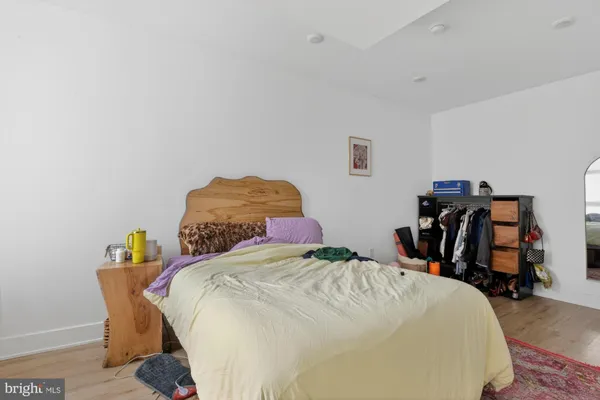 a bedroom with a bed and a closet