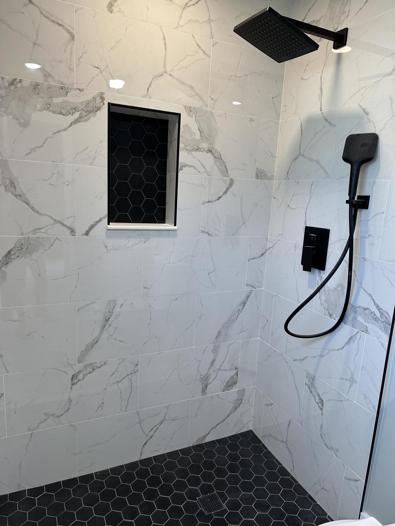 13357 Vía Vesta, Unit B Delray Beach, FL 33484 - Photo 17 of 26 a bathroom with a shower