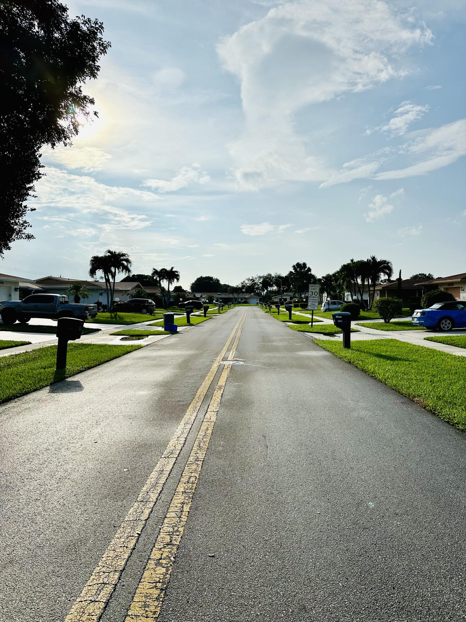 13357 Vía Vesta, Unit B Delray Beach, FL 33484 - Photo 2 of 26 a view of a golf course with a garden