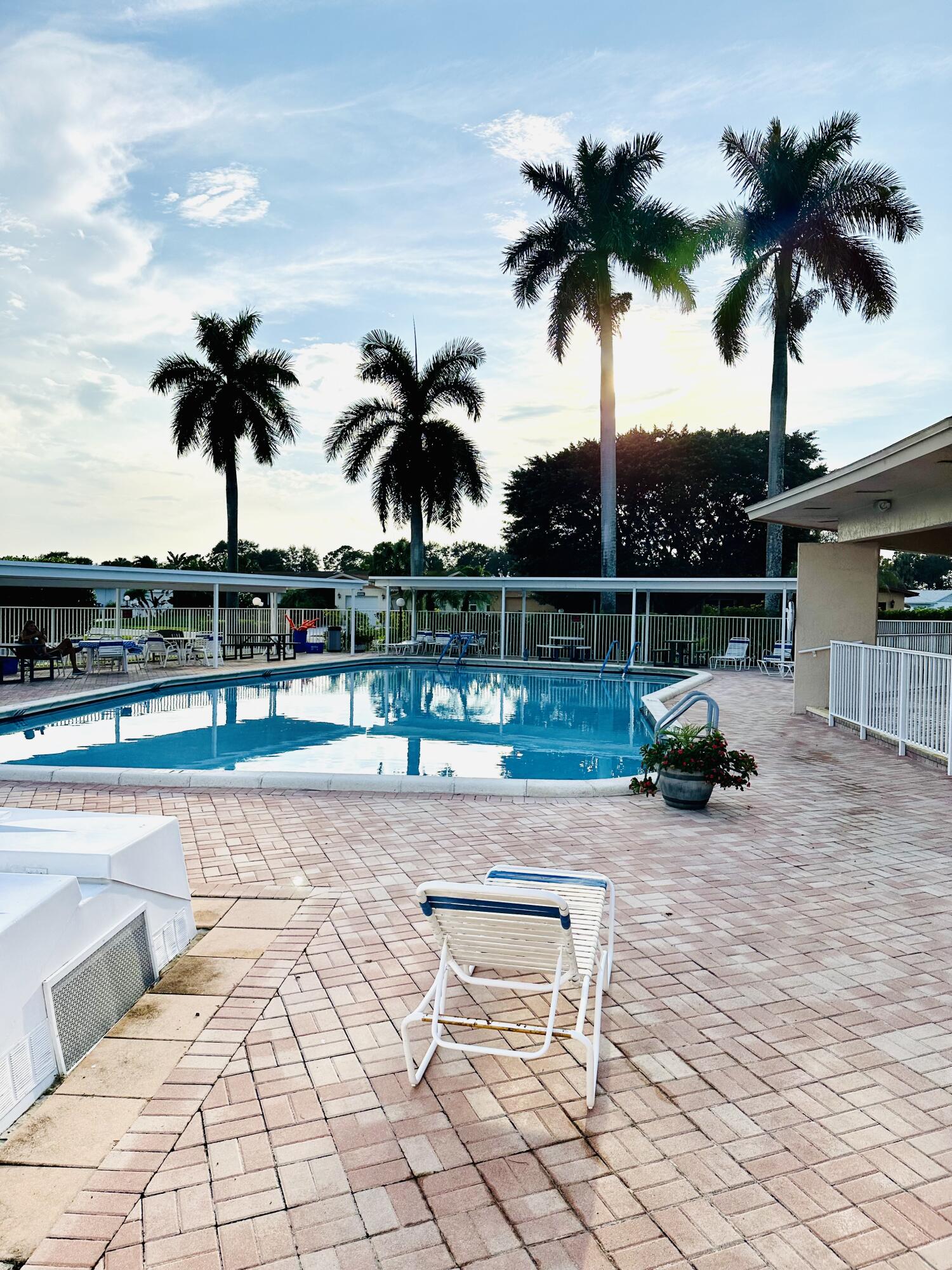 13357 Vía Vesta, Unit B Delray Beach, FL 33484 - Photo 25 of 26 a view of a backyard with a barbeque