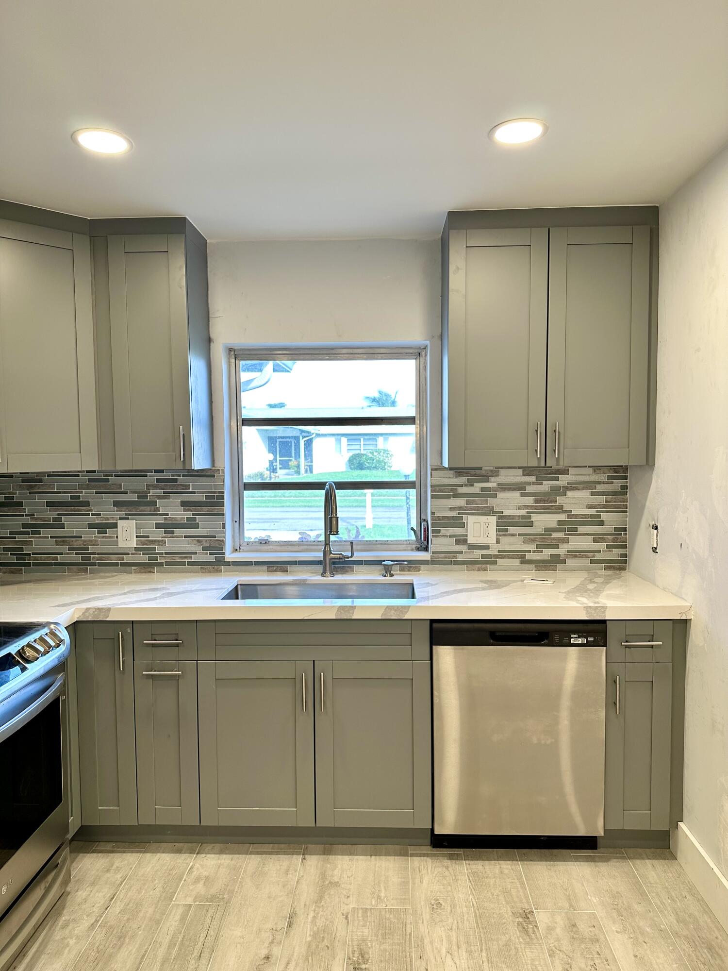 13357 Vía Vesta, Unit B Delray Beach, FL 33484 - Photo 9 of 26 a kitchen with a sink and cabinets