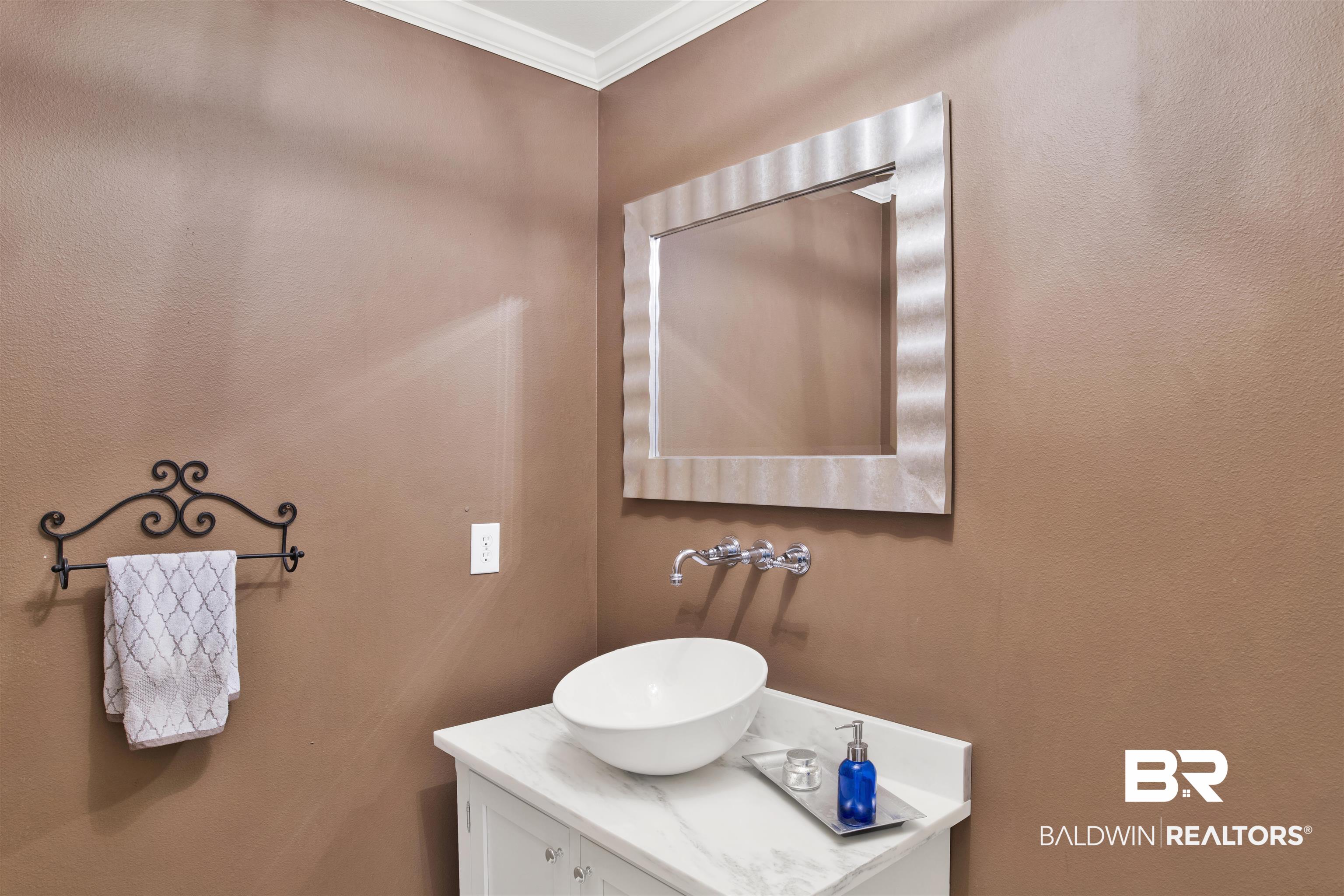 16864 Ferry Rd Circle Fairhope, AL 36532 - Photo 49 of 68 Bathroom featuring crown molding and vanity