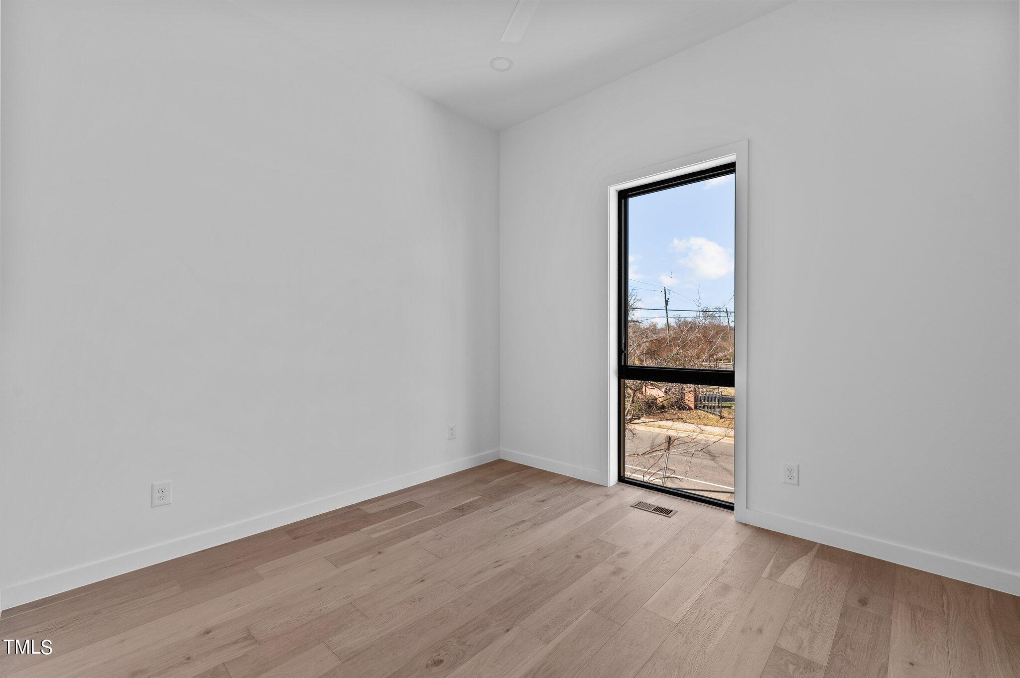 819 South Person Street Raleigh, NC 27601 - Photo 14 of 33 wooden floor in an empty room