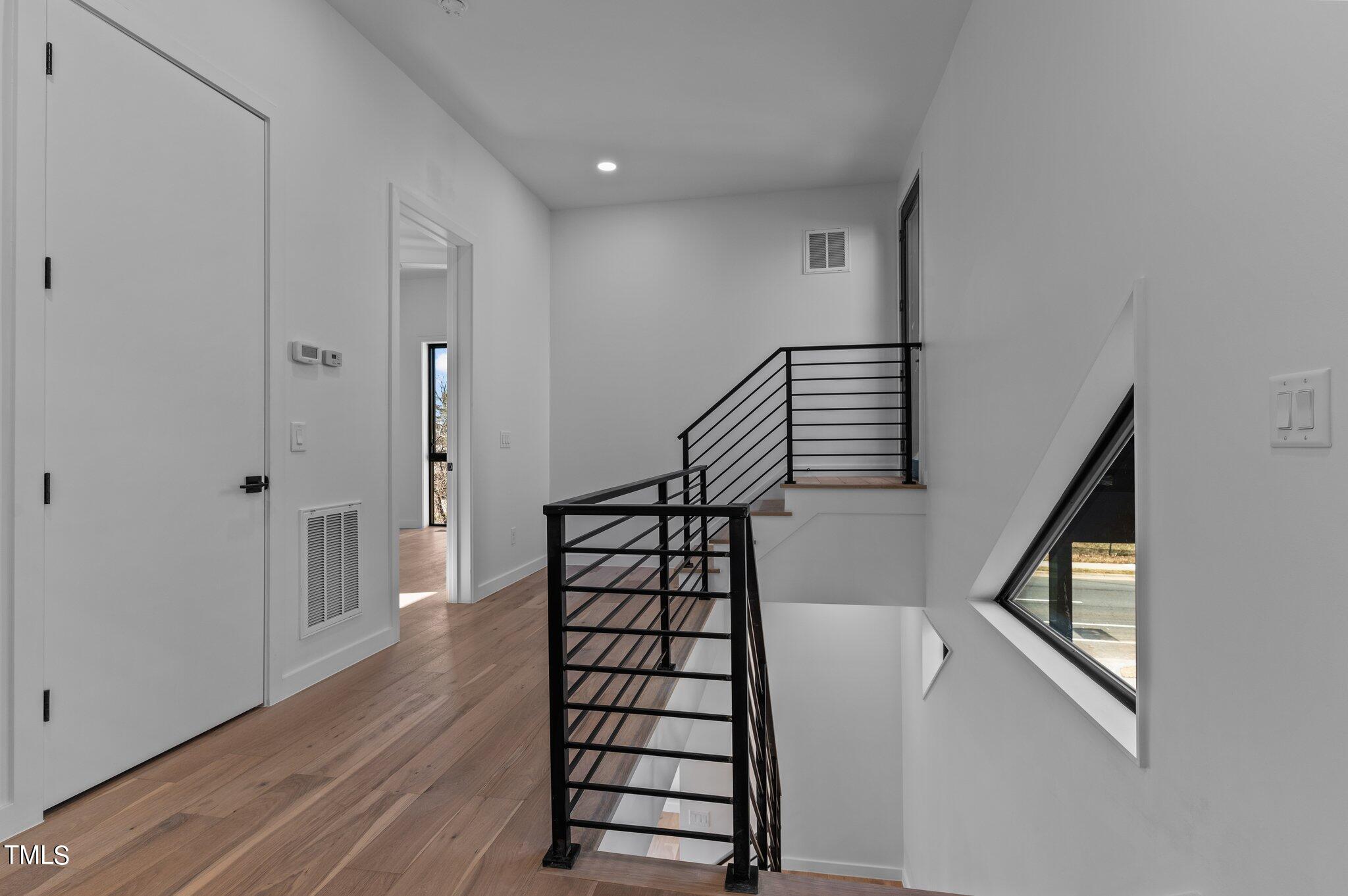 819 South Person Street Raleigh, NC 27601 - Photo 25 of 33 a view of entryway with wooden floor and stairs