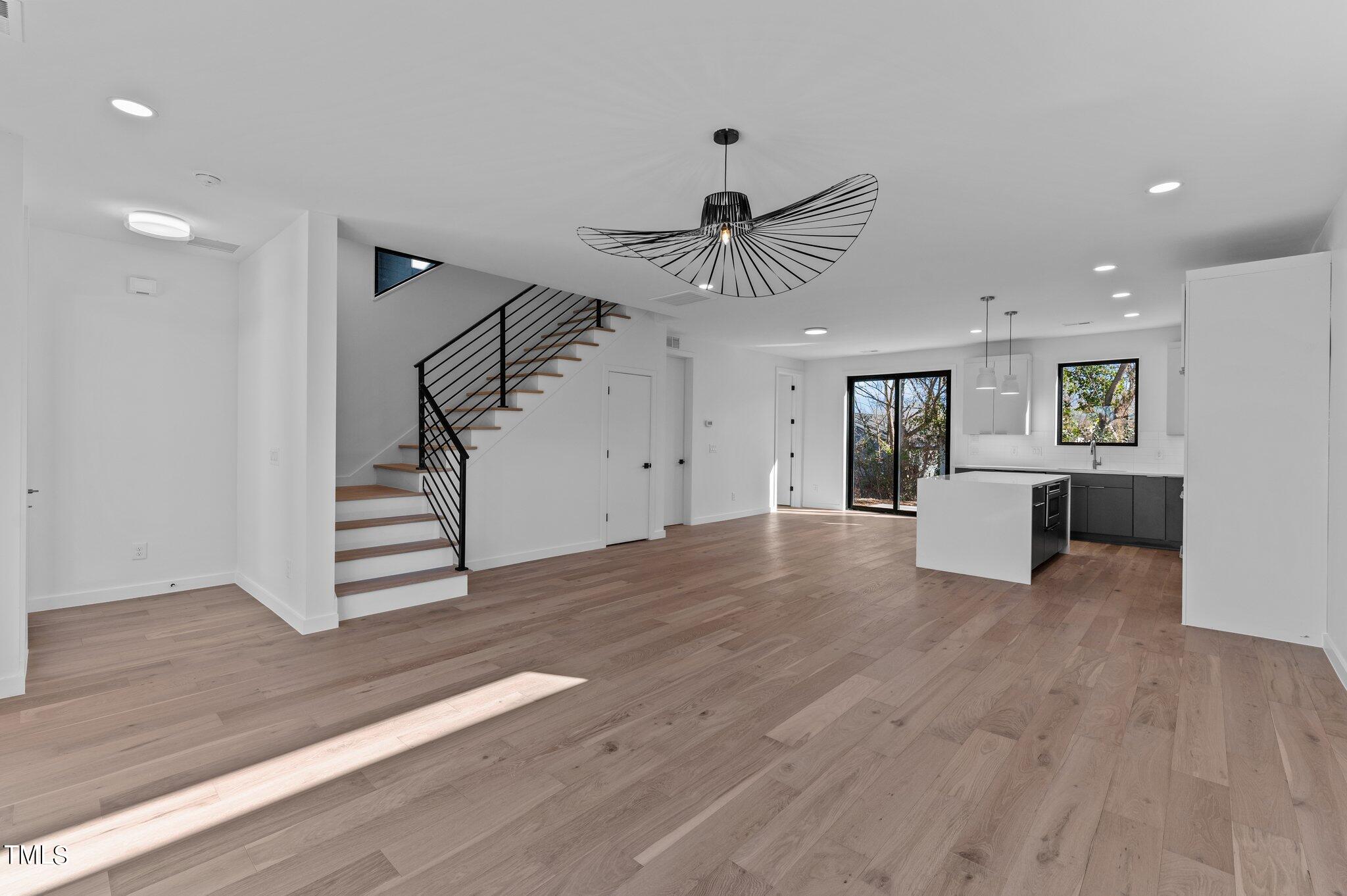 819 South Person Street Raleigh, NC 27601 - Photo 32 of 33 a view of a livingroom with wooden floor and ceiling fan