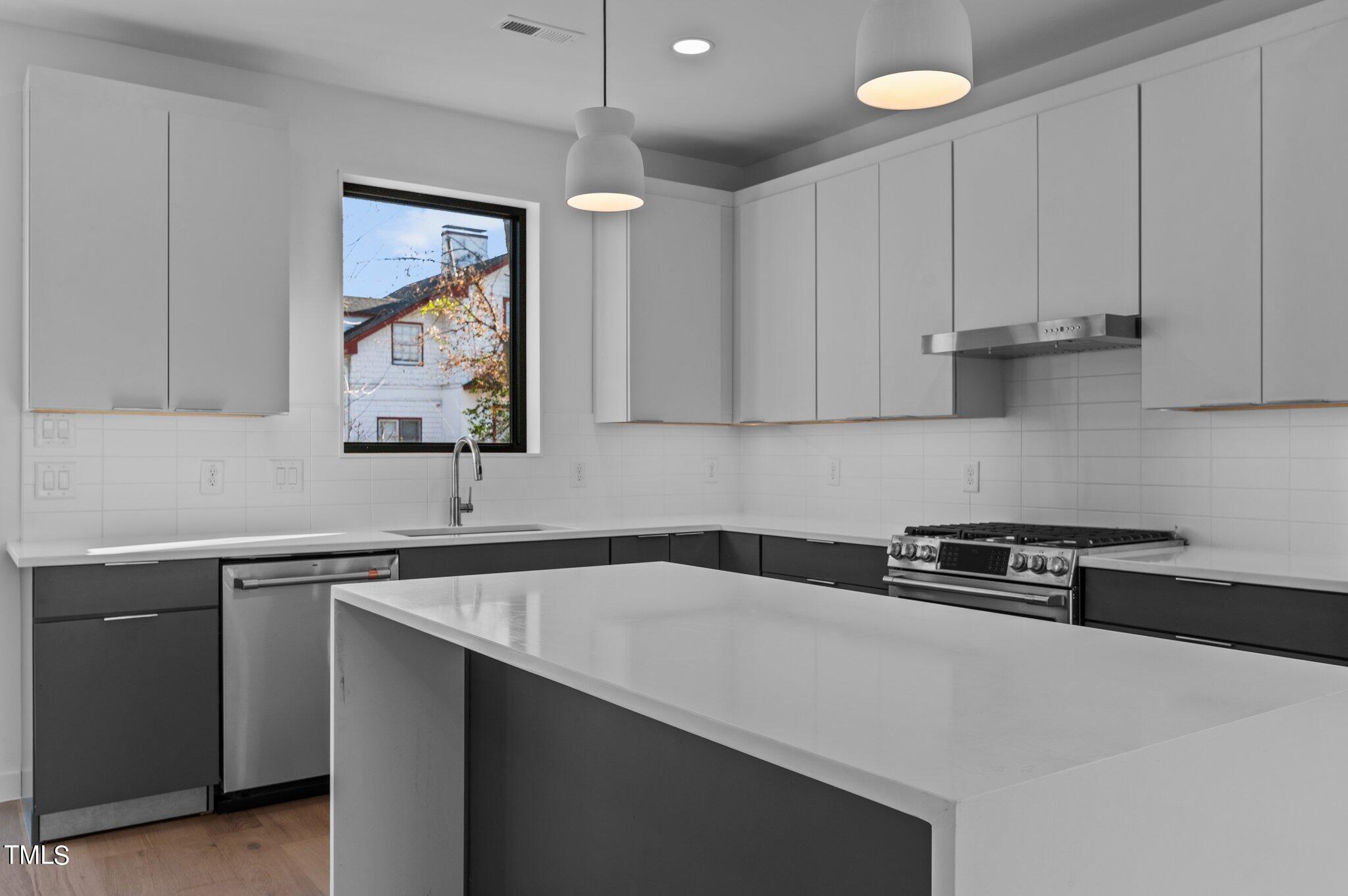 819 South Person Street Raleigh, NC 27601 - Photo 6 of 33 a kitchen with a sink and cabinets