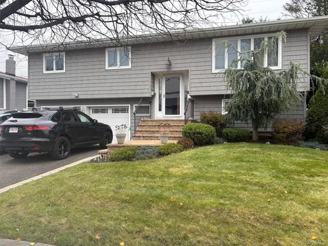 a view of a car parked in front of a house