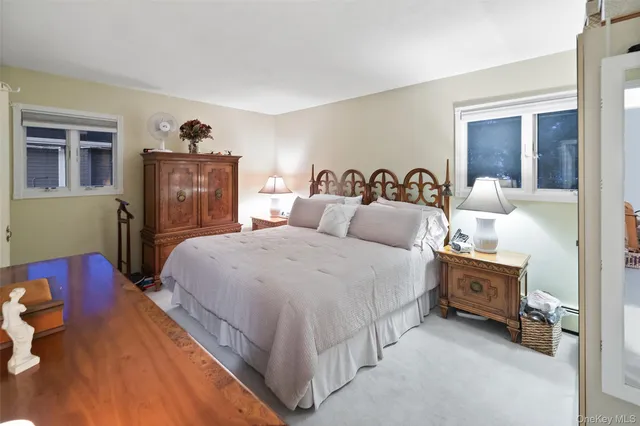 a bedroom with a bed and a cabinets