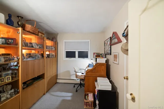 a room with furniture and white walls