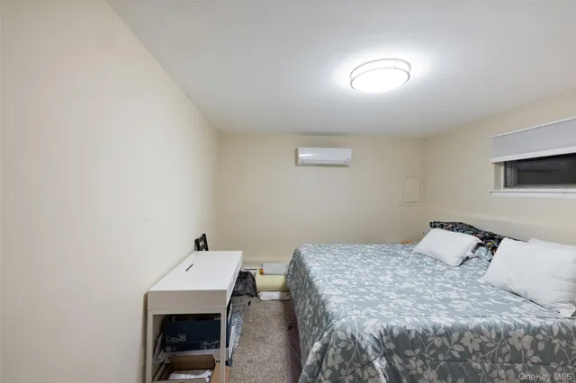 a bedroom with a bed and a table