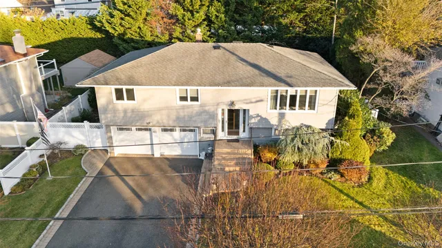 a house with trees in the background