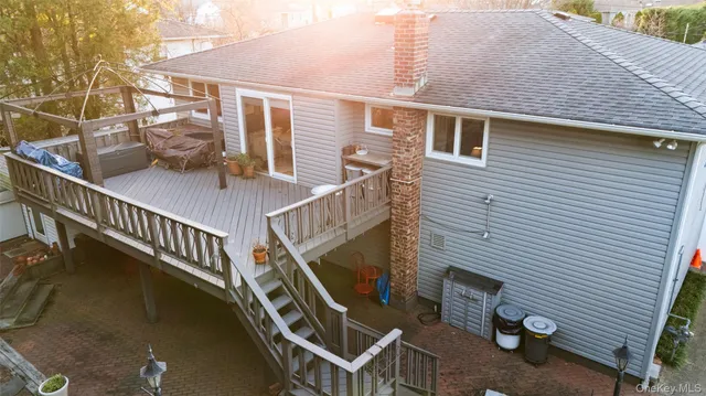 a balcony with table and chairs