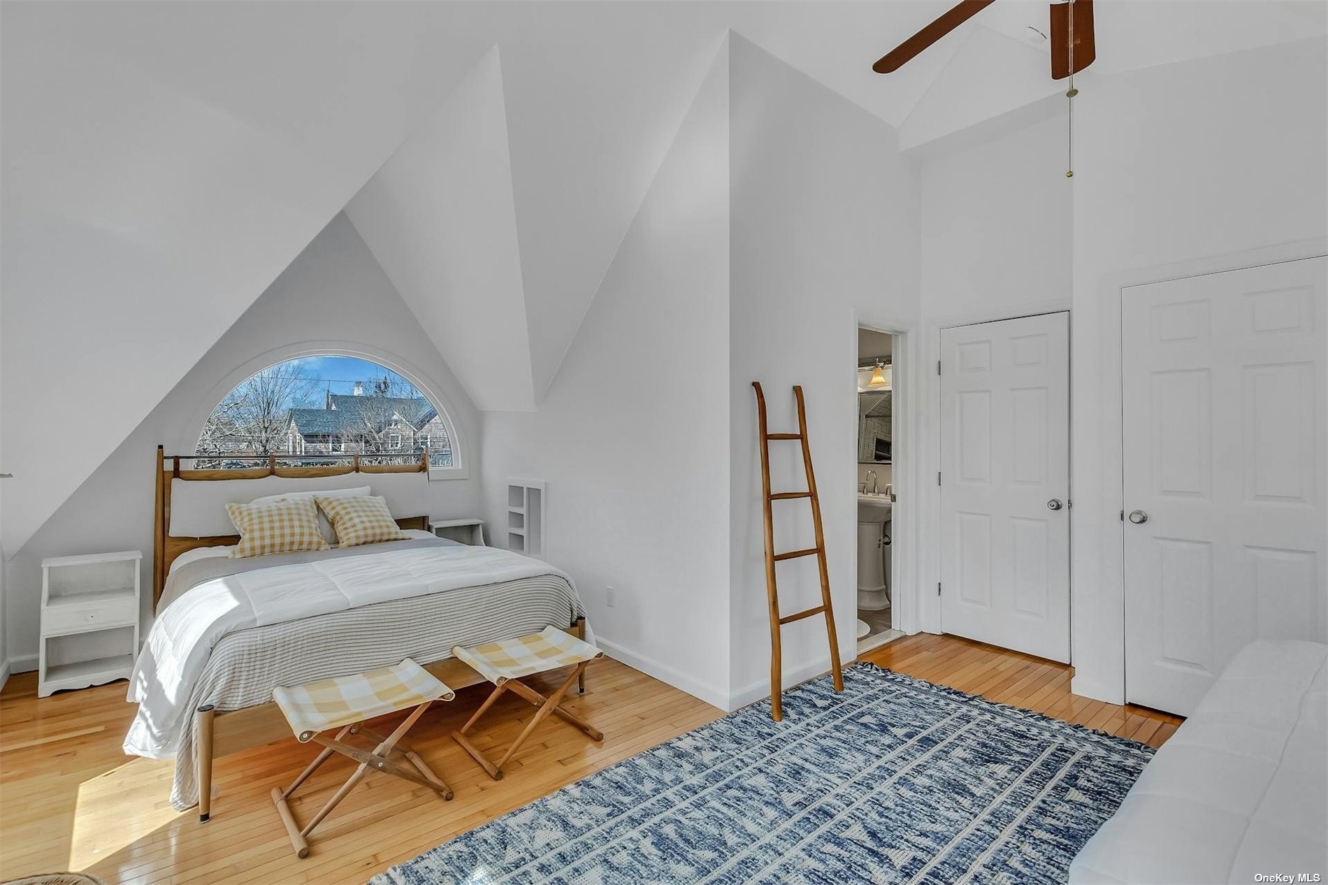 6 Remsenburg, undefined 00000 - Photo 18 of 31 a bedroom with a bed and a rug