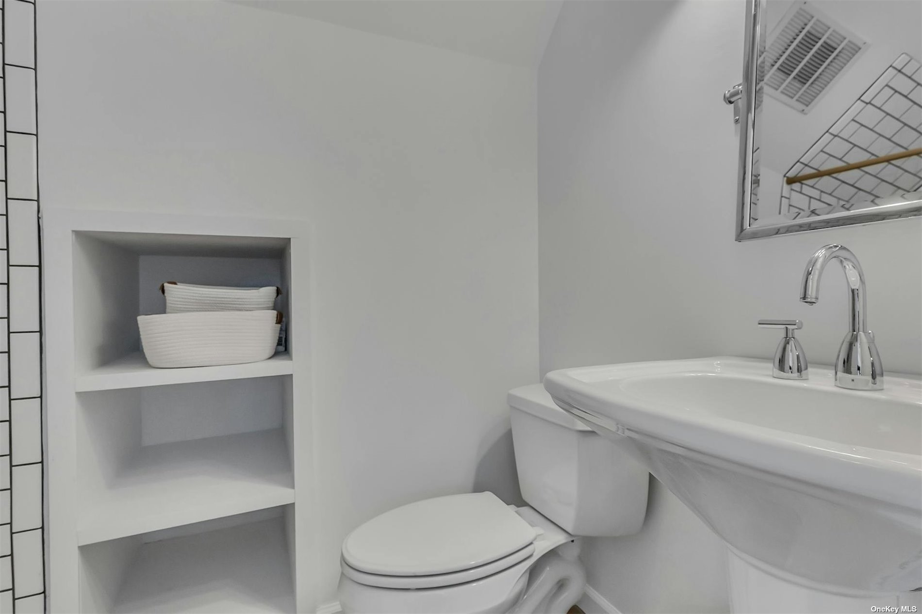 6 Remsenburg, undefined 00000 - Photo 20 of 31 a bathroom with a toilet a sink and mirror