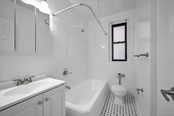 a spacious bedroom with a bed and glass door