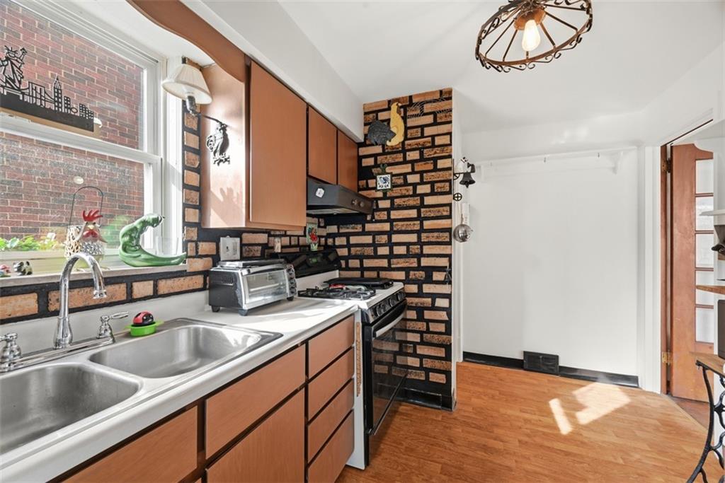 7210 Raymond Street Pittsburgh, PA 15218 - Photo 12 of 37 a kitchen with a sink and a window