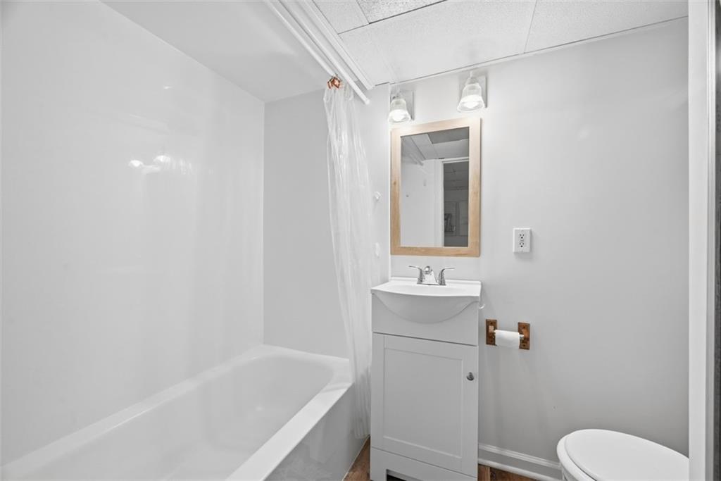 7210 Raymond Street Pittsburgh, PA 15218 - Photo 24 of 37 a bathroom with a sink a toilet and shower