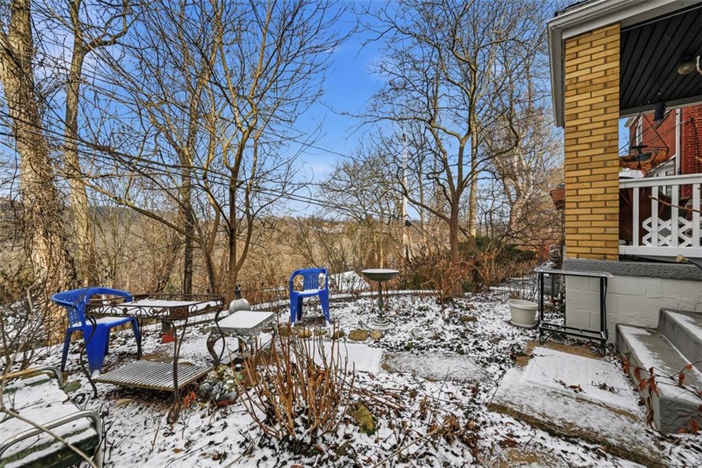 7210 Raymond Street Pittsburgh, PA 15218 - Photo 29 of 37 a backyard of a house with table and chairs