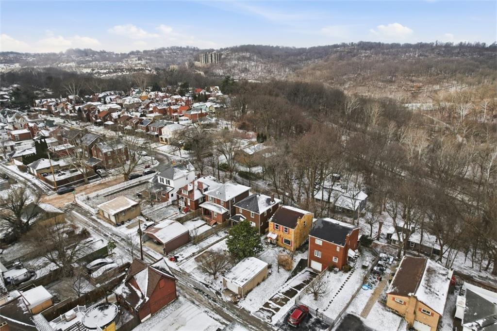 7210 Raymond Street Pittsburgh, PA 15218 - Photo 35 of 37 an aerial view of residential house with parking and trees
