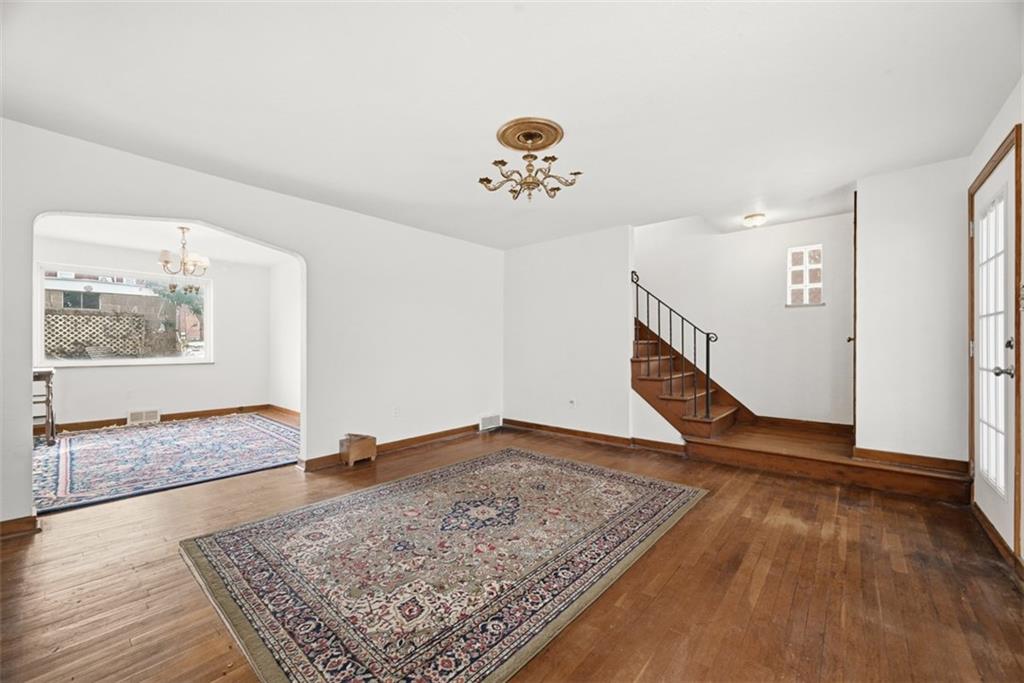 7210 Raymond Street Pittsburgh, PA 15218 - Photo 5 of 37 a view of an empty room and wooden floor