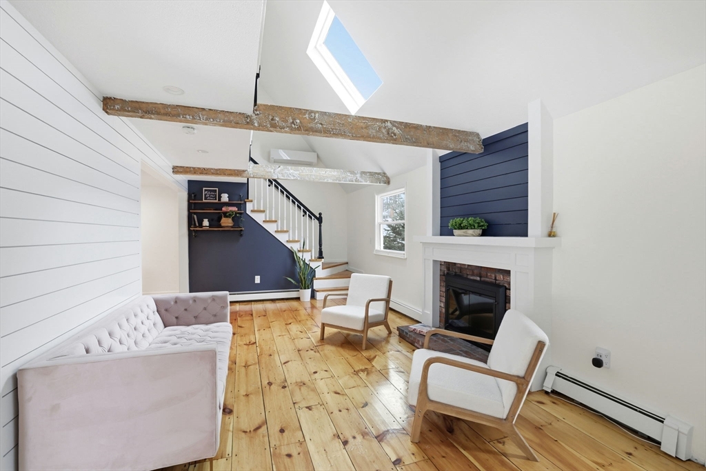 34 Flintlock Ridge Road Cohasset, MA 02025 - Photo 12 of 33 a living room with furniture and a fireplace