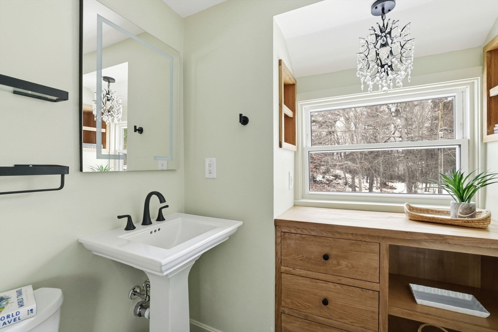 34 Flintlock Ridge Road Cohasset, MA 02025 - Photo 21 of 33 a bathroom with a sink and a mirror