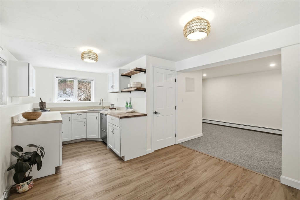 34 Flintlock Ridge Road Cohasset, MA 02025 - Photo 24 of 33 a view of a kitchen with furniture and wooden floor