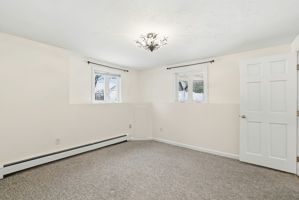 34 Flintlock Ridge Road Cohasset, MA 02025 - Photo 26 of 33 a view of an empty room with a window