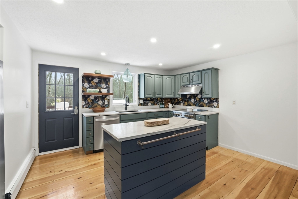 34 Flintlock Ridge Road Cohasset, MA 02025 - Photo 6 of 33 a kitchen with stainless steel appliances granite countertop a sink stove and refrigerator