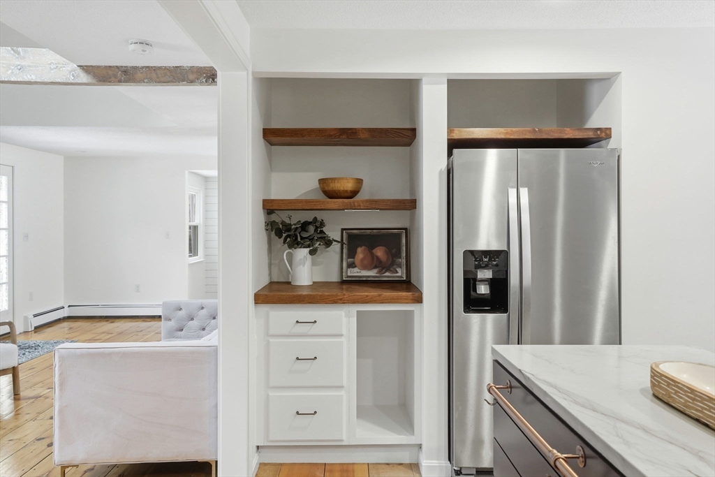 34 Flintlock Ridge Road Cohasset, MA 02025 - Photo 7 of 33 a kitchen with a refrigerator and cabinets