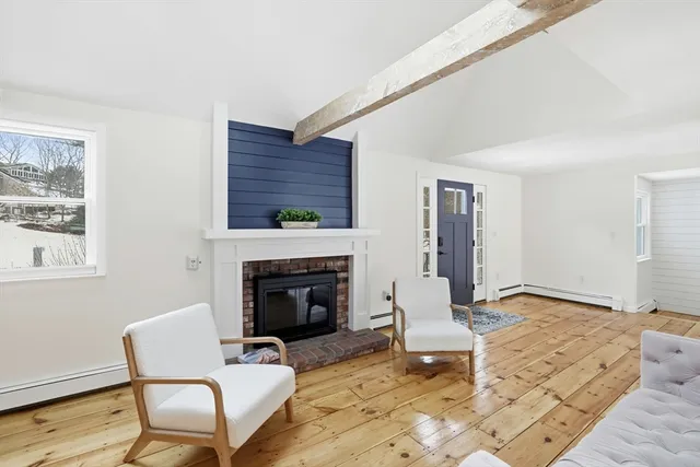 a view of living room with furniture and flat screen tv