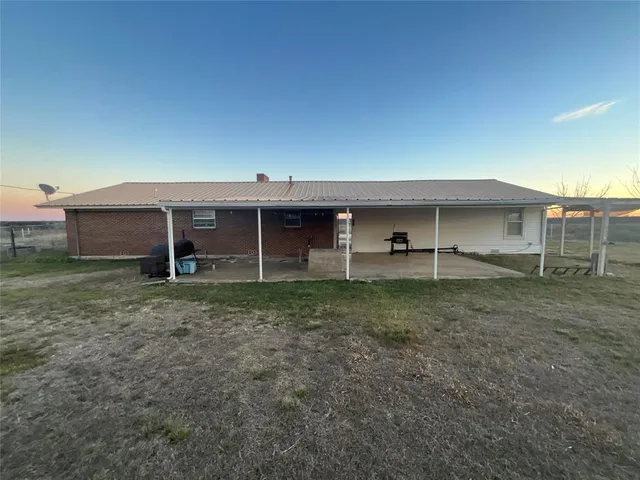 a kitchen with stainless steel appliances granite countertop a refrigerator a stove and a sink