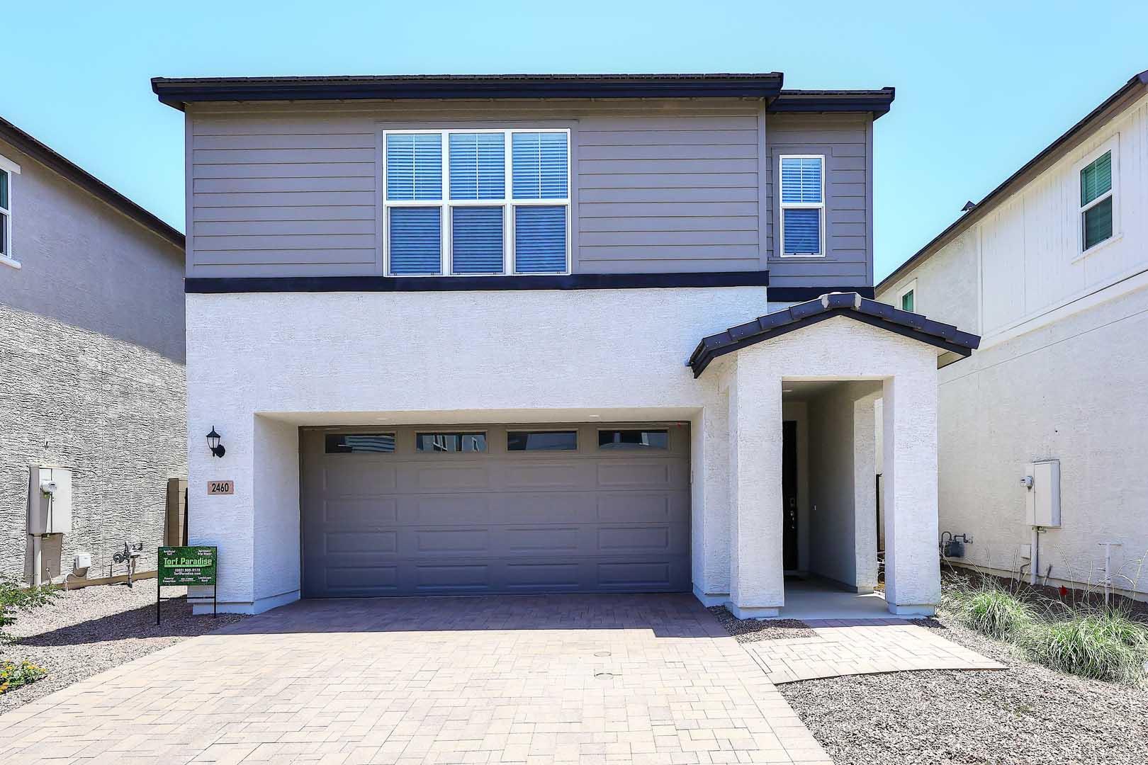 a front view of a house with garage