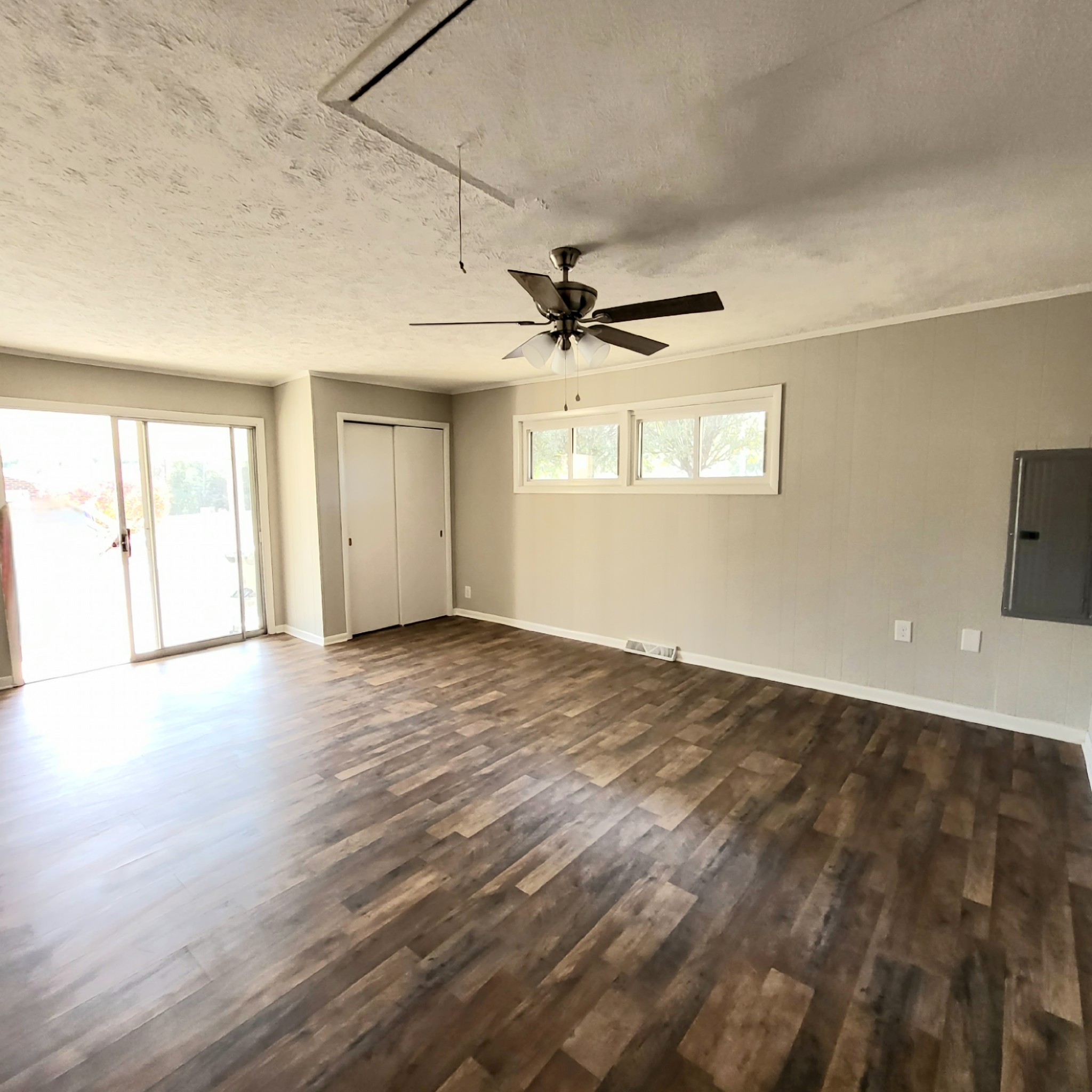 500 West Point Road Lawrenceburg, TN 38464 - Photo 23 of 37 an empty room with wooden floor and windows