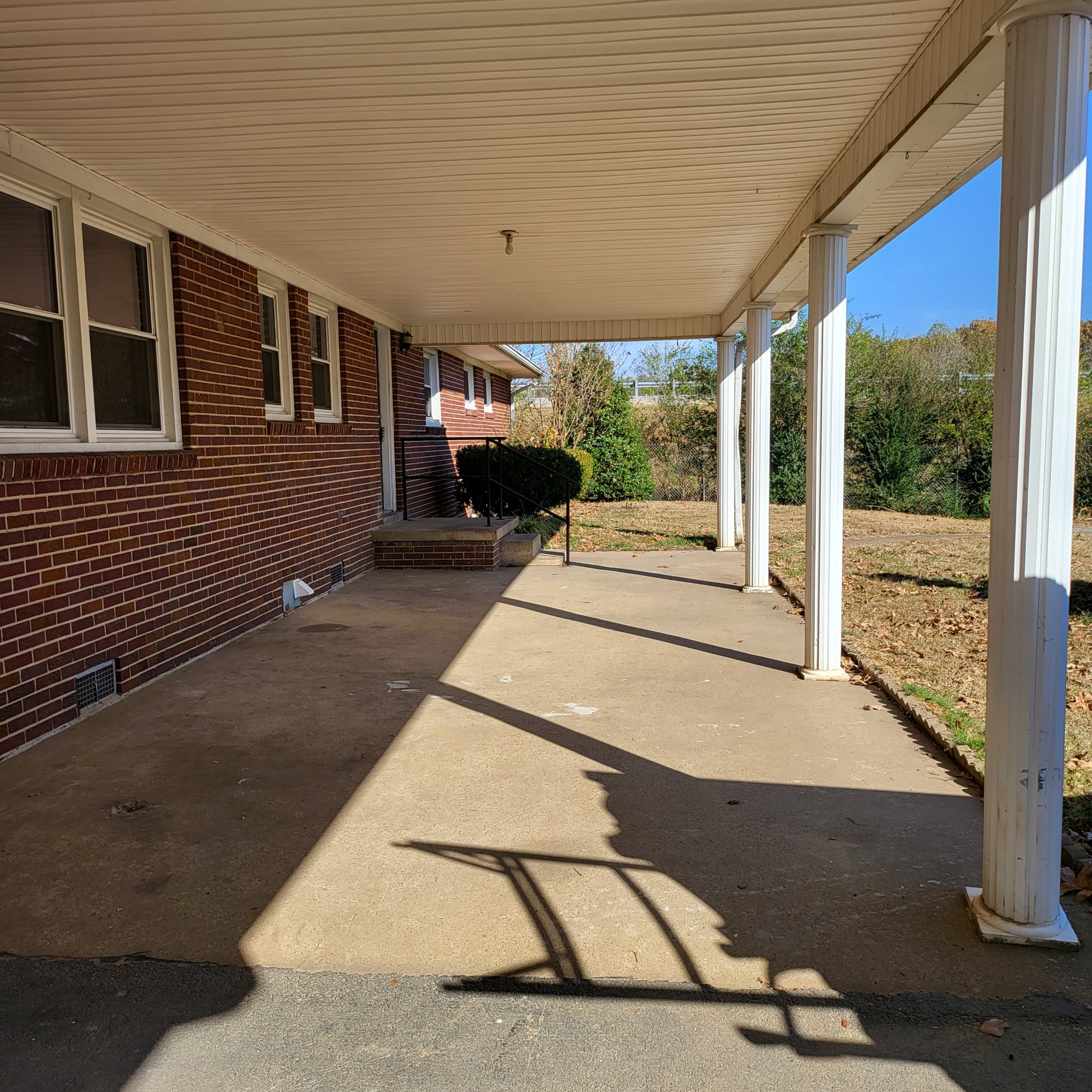 500 West Point Road Lawrenceburg, TN 38464 - Photo 30 of 37 a view of a patio with table and chairs in front of a house
