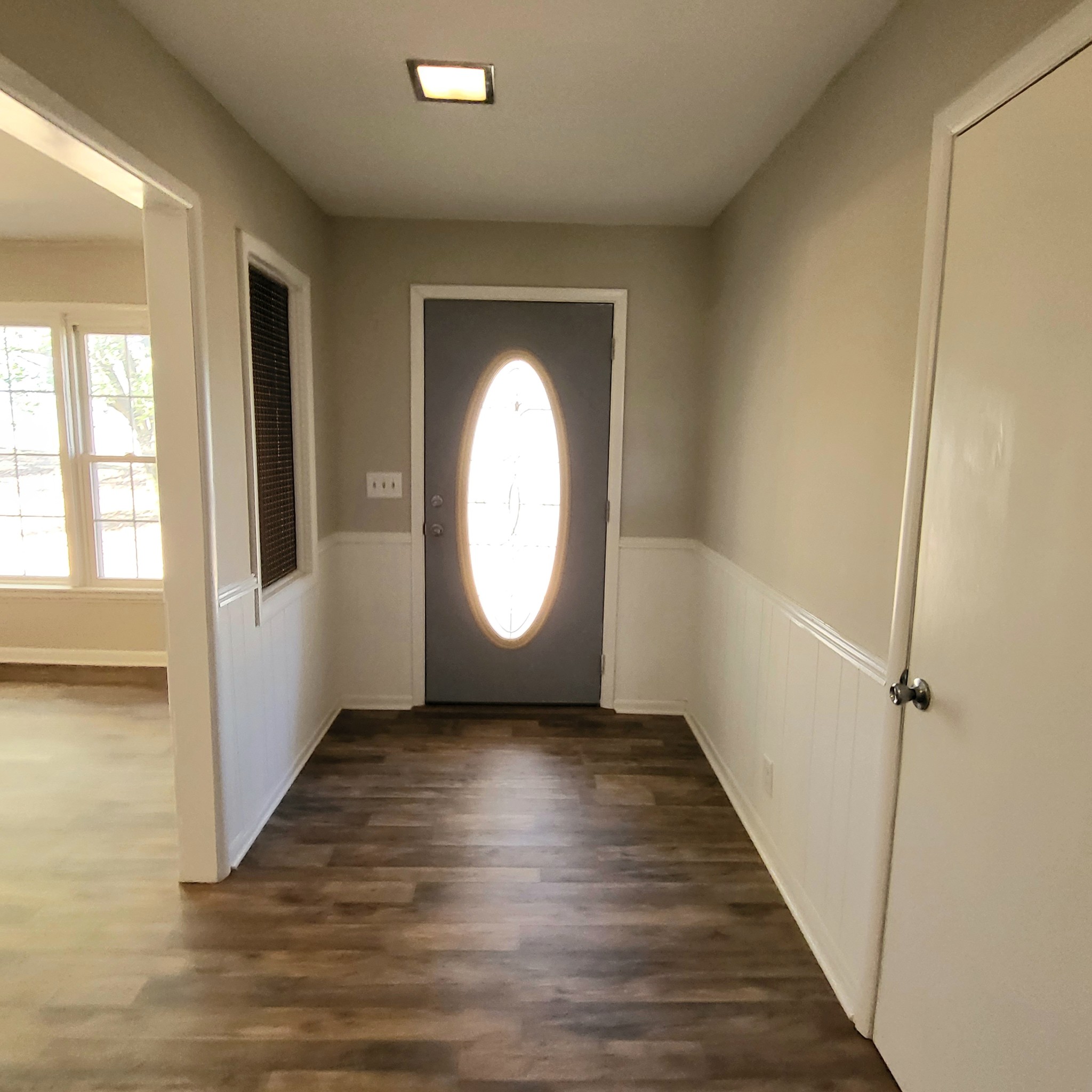 500 West Point Road Lawrenceburg, TN 38464 - Photo 6 of 37 wooden floor in an empty room with a window